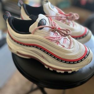 White black and red Nike 97s